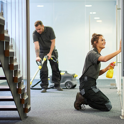 Cleaning Crew Working in Office Hall